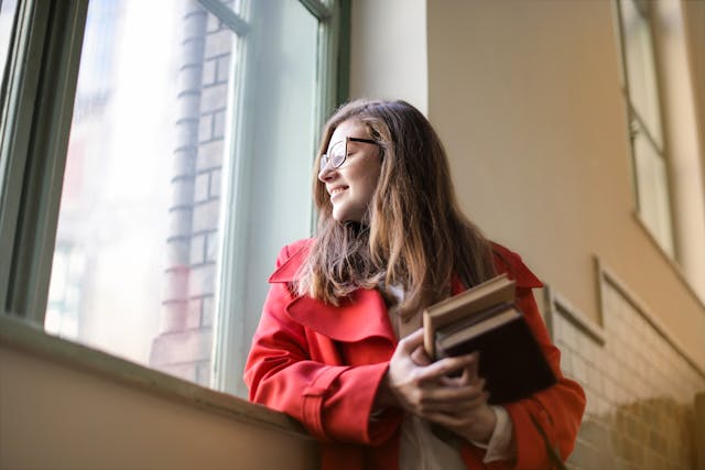 Student studying with open books and notes in Italy